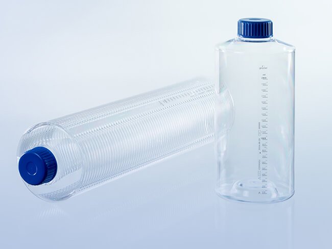 Two roller bottles, one standing and one lying